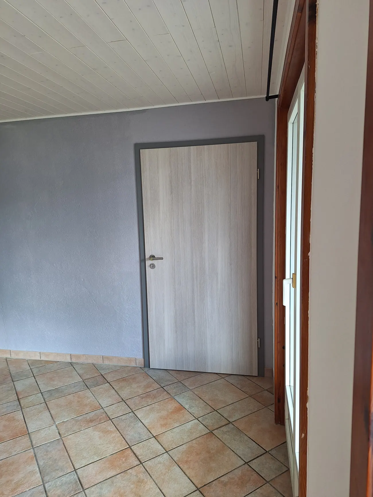 Finished partition wall with door